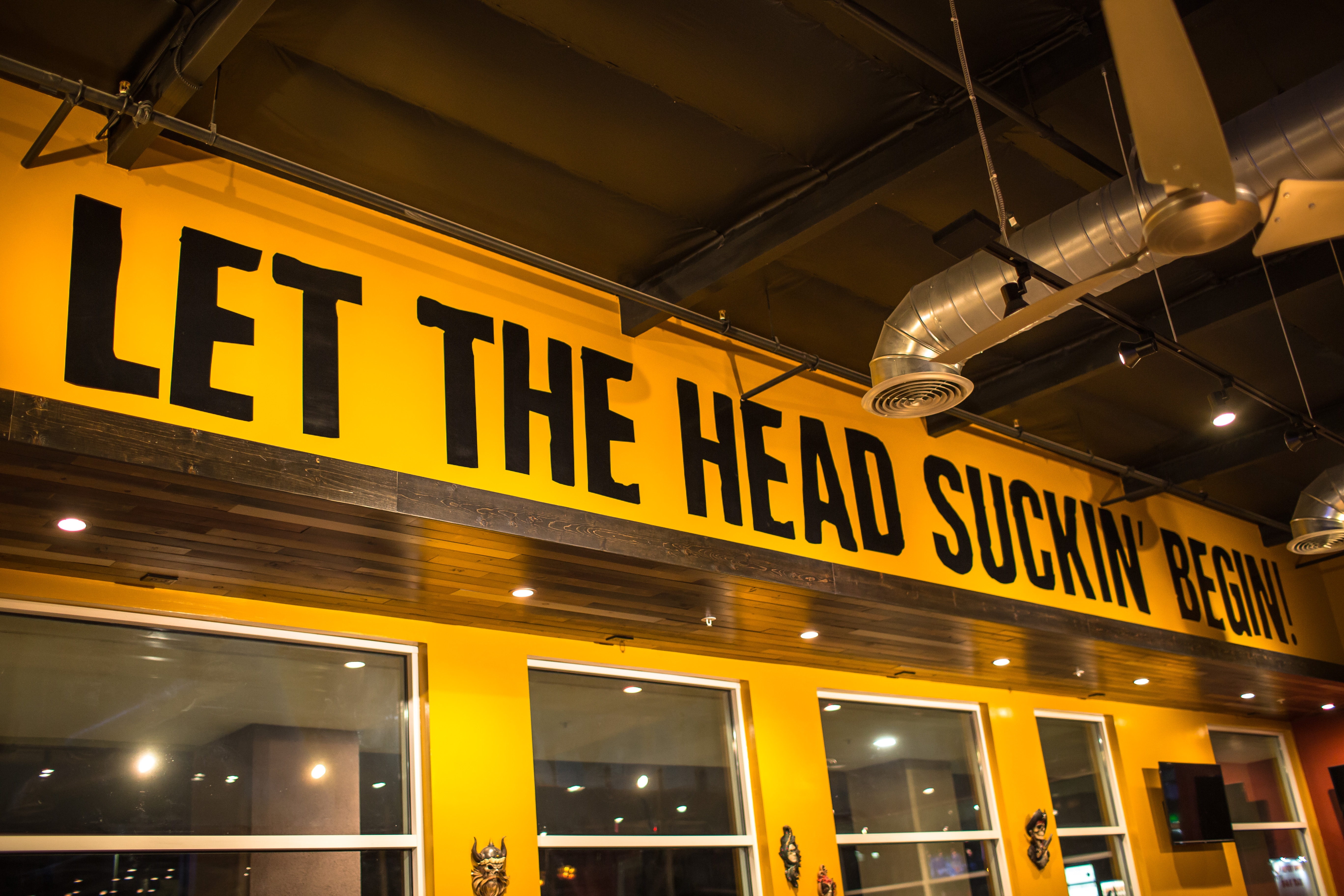 Logo wall inside CLAWS Restaurant